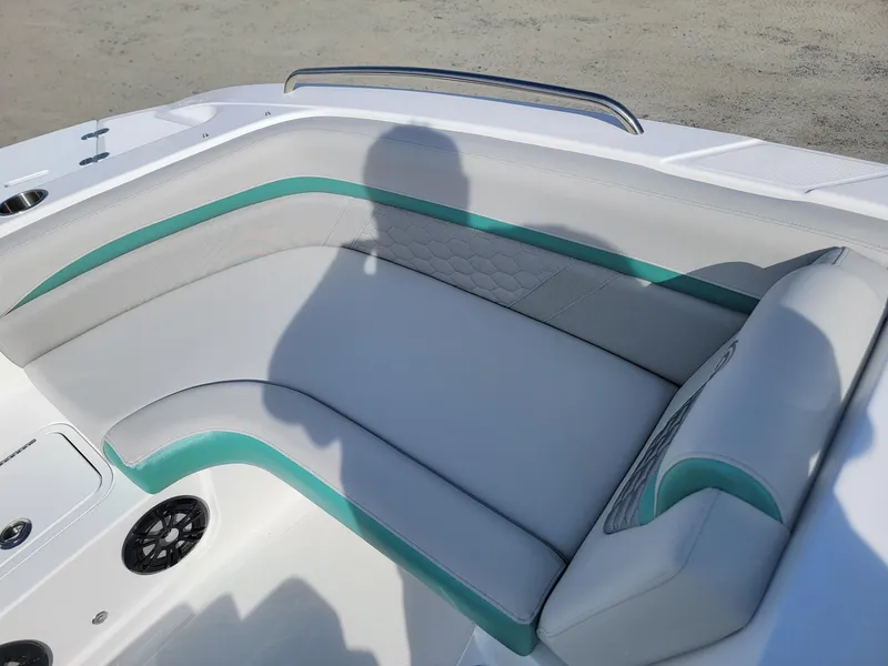 Slide: The Image of 2024 Hurricane SunDeck Sport 192 RL OB boat interior seating with teal accents. - 11