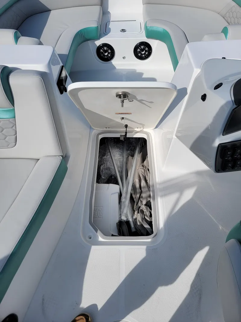 Slide: The Image of 2024 Hurricane SunDeck Sport 192 RL OB boat interior storage compartment. - 15