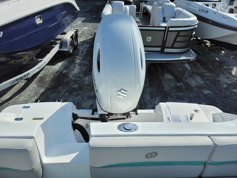 Slide: The Image of 2024 Hurricane SunDeck Sport 192 RL OB boat with outboard motor, rear view. - 18