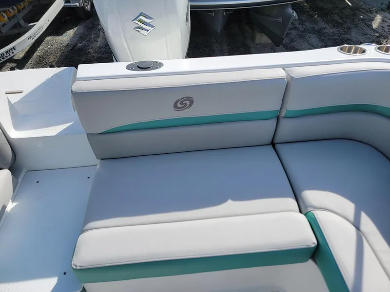 Slide: The Image of 2024 Hurricane SunDeck Sport 192 RL OB boat seating area with white and teal upholstery. - 20