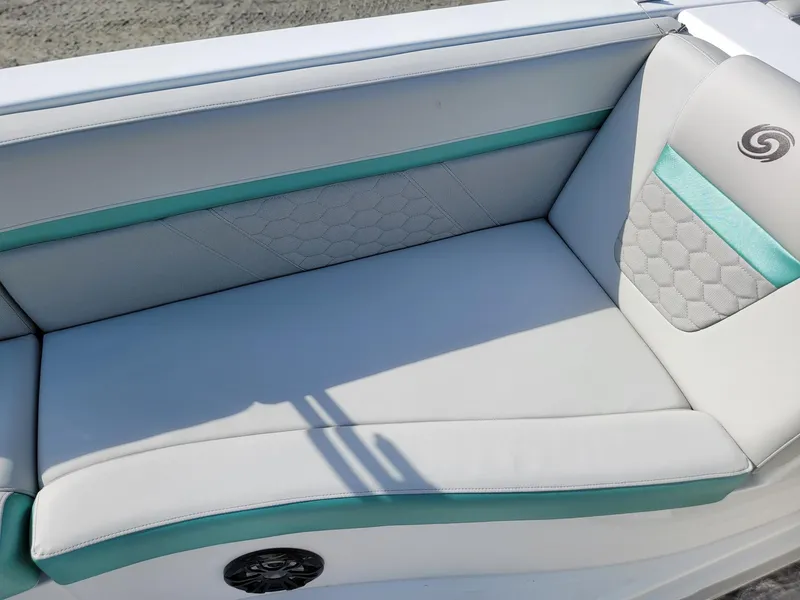 Slide: The Image of 2024 Hurricane SunDeck Sport 192 RL OB boat seating with teal accents. - 22