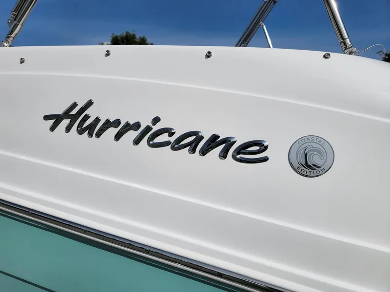 Slide: The Image of 2024 Hurricane SunDeck Sport 192 RL OB boat logo and Coastal Edition emblem. - 23
