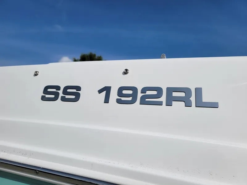 Slide: The Image of 2024 Hurricane SunDeck Sport 192 RL OB boat model nameplate - 24