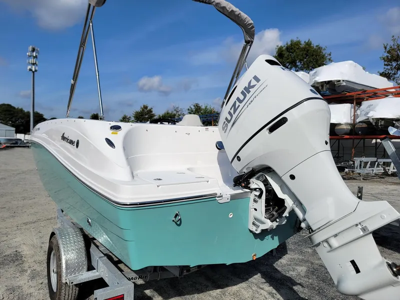 Slide: The Image of 2024 Hurricane SunDeck Sport 192 RL OB boat with Suzuki outboard motor. - 3