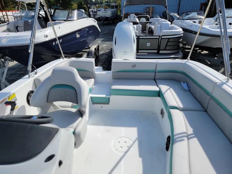 Slide: The Image of 2024 Hurricane SunDeck Sport 192 RL OB boat interior with seating and steering console. - 8