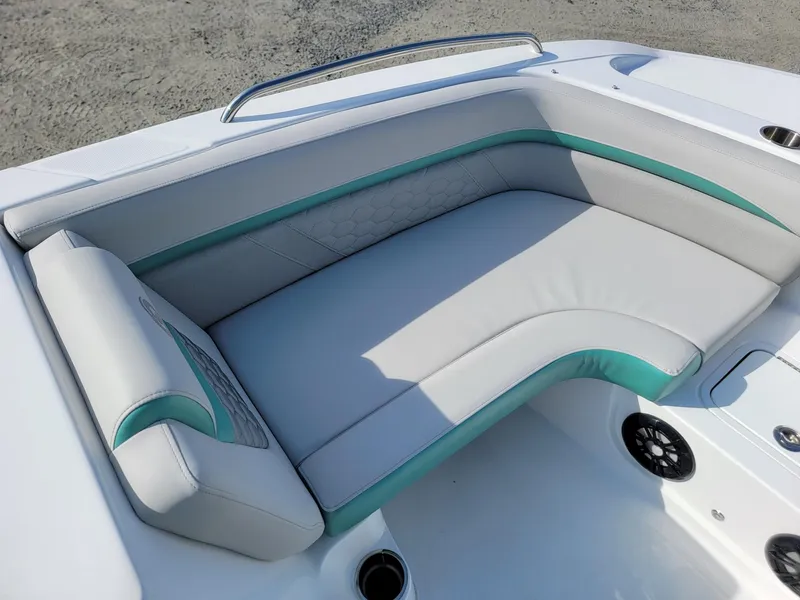 Slide: The Image of 2024 Hurricane SunDeck Sport 192 RL OB boat seating area with white and teal upholstery. - 9