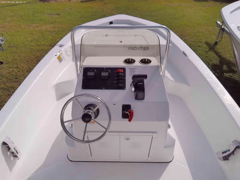 Slide: The Image of 2024 Frontier 180 boat console with steering wheel and controls. - 4