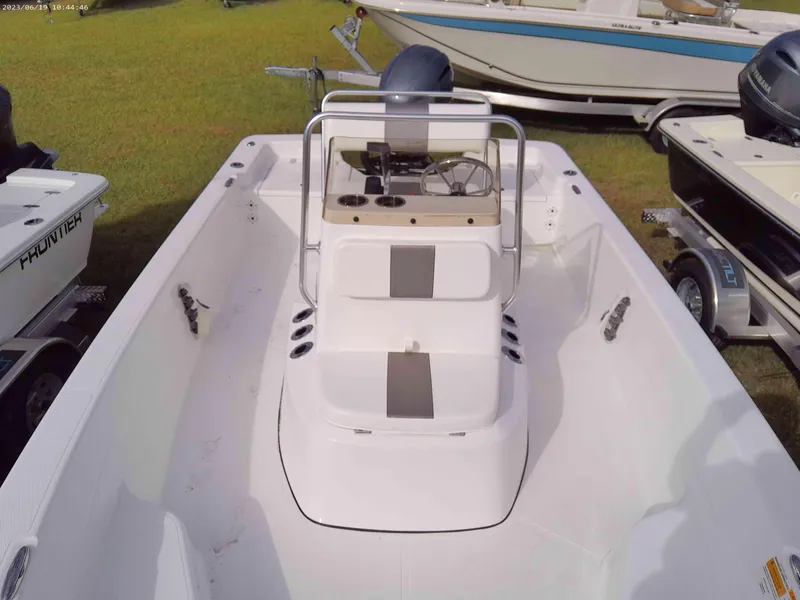 Slide: The Image of 2024 Frontier 180 boat interior with center console and seating. - 6