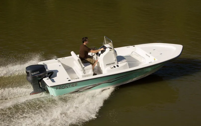 Slide: The Image of 2024 Frontier 180 boat cruising on water with Yamaha outboard motor. - 9