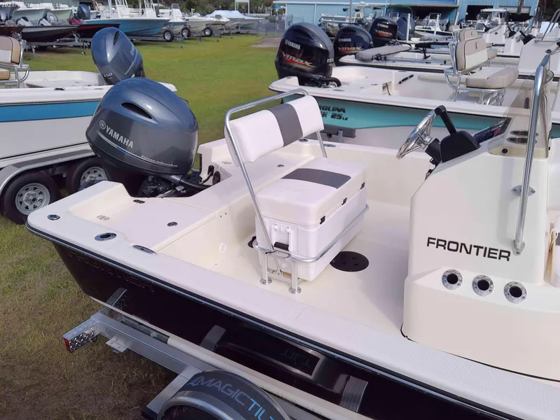 Slide: The Image of 2024 Frontier 18 boat with Yamaha outboard motor, white interior, and trailer. - 3