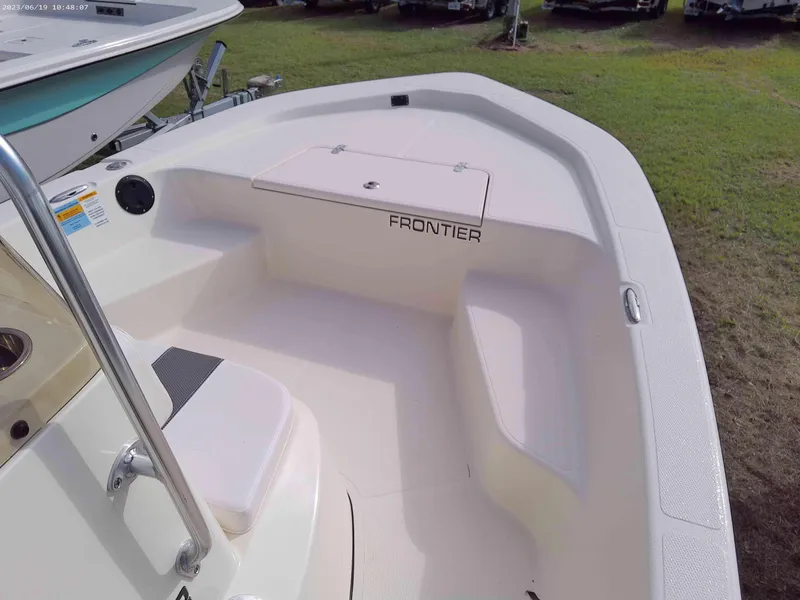 Slide: The Image of 2024 Frontier 18 boat interior with seating and storage compartments. - 5