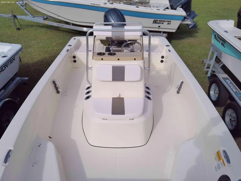 Slide: The Image of 2024 Frontier 18 Frontier boat interior with seating and console. - 6