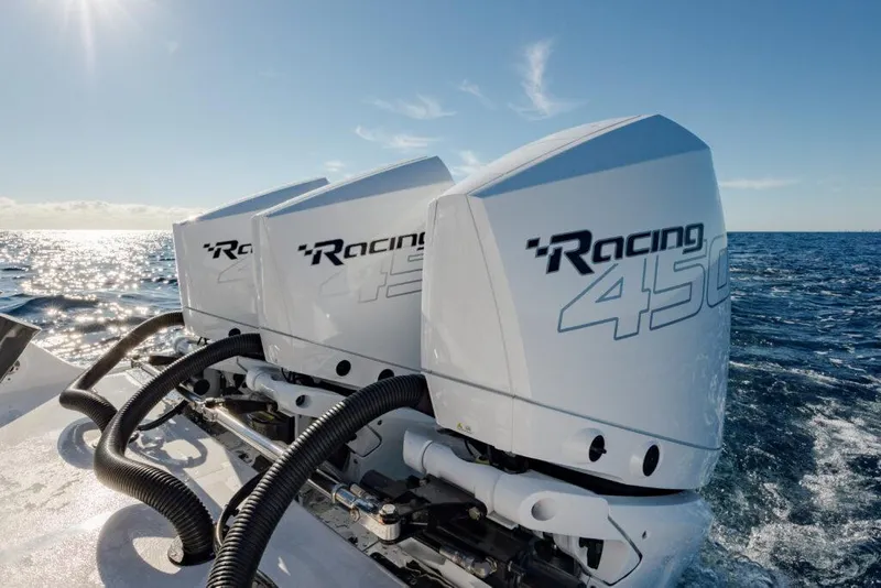 Slide: The Image of Triple Racing 450 engines on 2025 Front Runner 36 CC Custom boat at sea. - 1