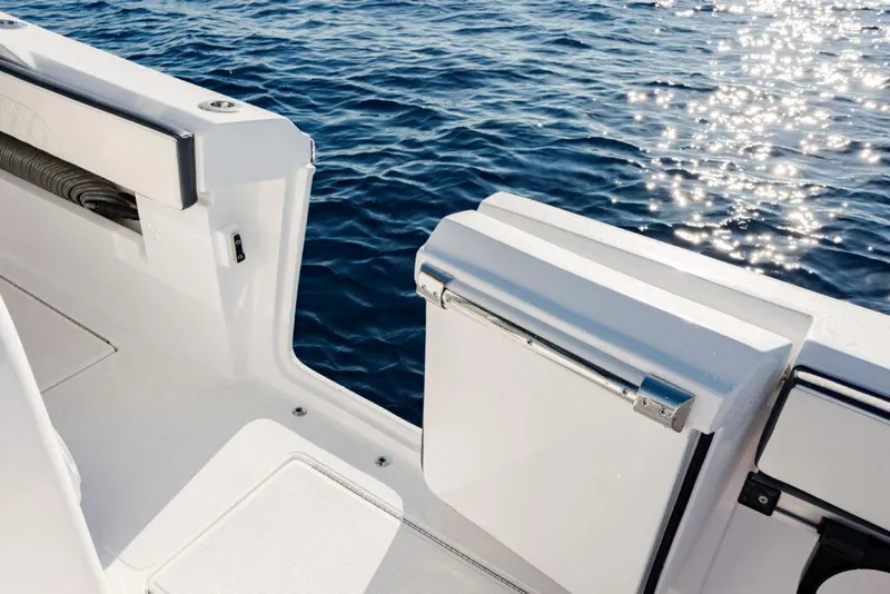Slide: The Image of 2025 Front Runner 36 CC Custom boat, sleek design, open deck, sparkling ocean backdrop. - 10