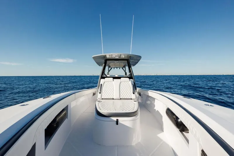 Slide: The Image of 2025 Front Runner 36 CC Custom boat on open sea under clear blue sky. - 14