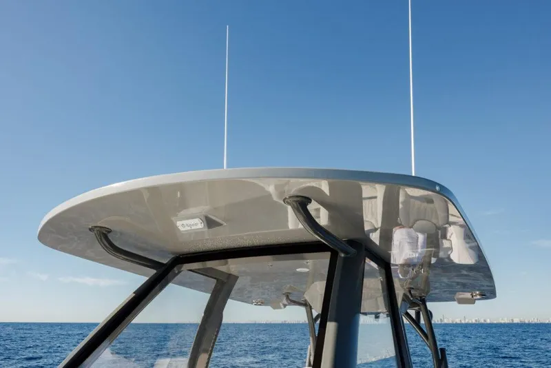 Slide: The Image of 2025 Front Runner 36 CC Custom boat on open sea, clear sky background. - 15