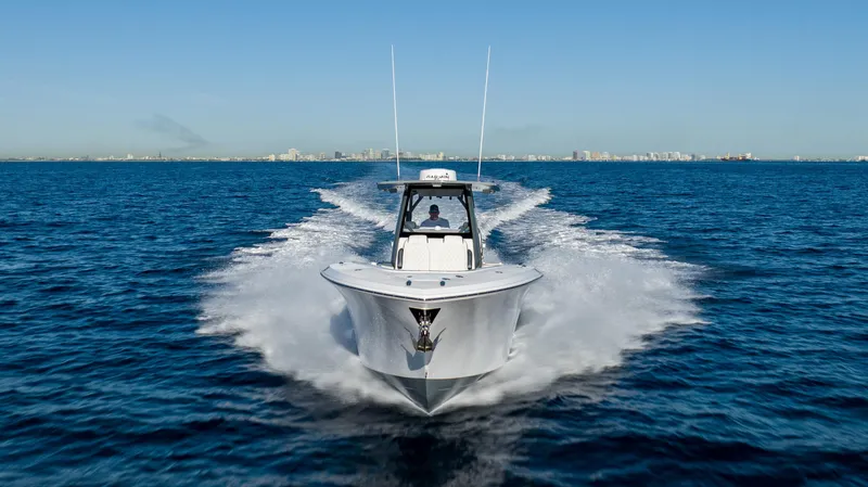 Slide: The Image of 2025 Front Runner 36 CC Custom boat cruising on open water. - 16