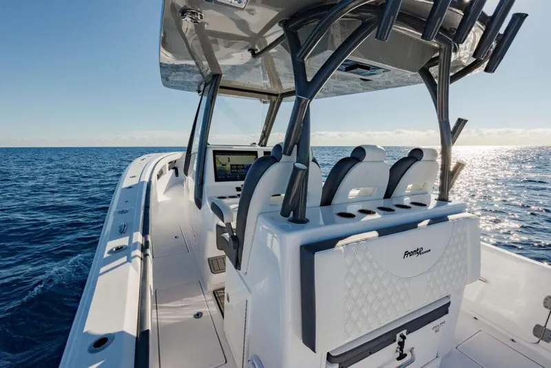 Slide: The Image of 2025 Front Runner 36 CC Custom boat on open ocean, featuring sleek design and modern controls. - 5