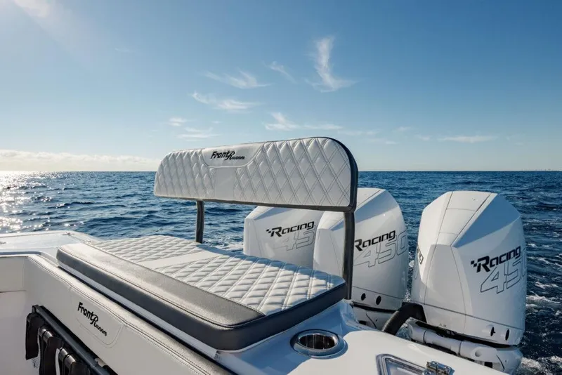 Slide: The Image of 2025 Front Runner 36 CC Custom boat with powerful outboard engines on open sea. - 6