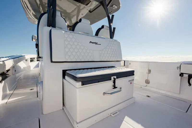 Slide: The Image of 2025 Front Runner 36 CC Custom boat interior with seating and storage under sunny sky. - 9