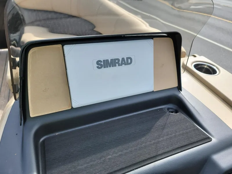 Slide: The Image of Simrad navigation system on 2024 Harris Sunliner 210 boat dashboard. - 16