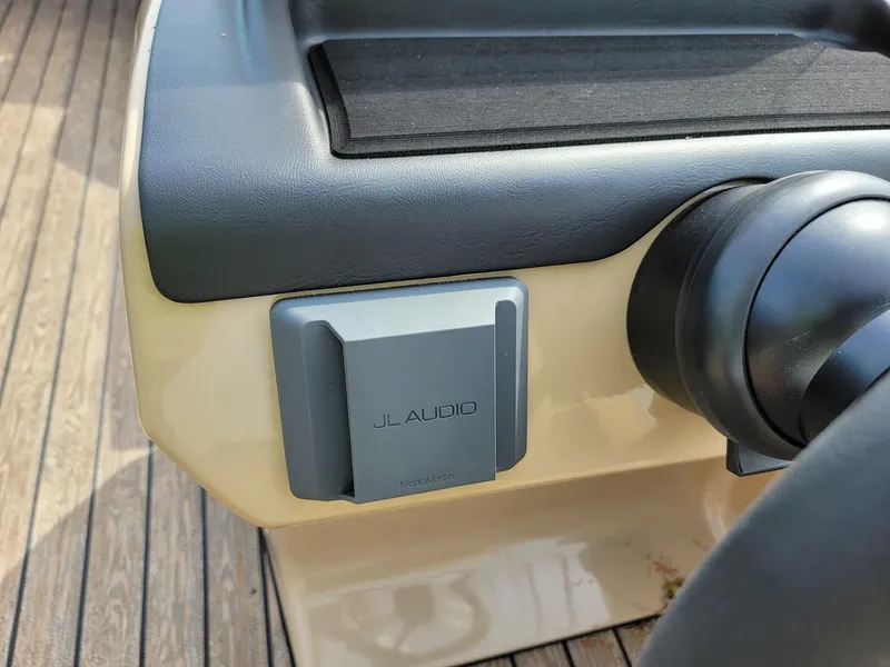 Slide: The Image of JL Audio system on 2024 Harris Sunliner 210 boat dashboard. - 17