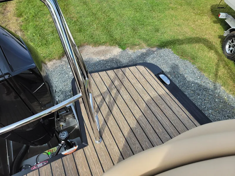 Slide: The Image of 2024 Harris Sunliner 210 boat deck with stainless steel railing. - 24