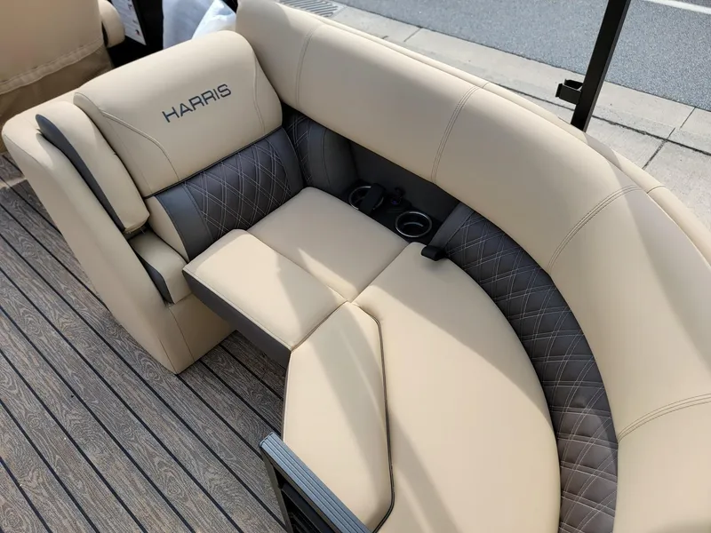 Slide: The Image of 2024 Harris Sunliner 210 boat interior with beige and gray seating. - 28