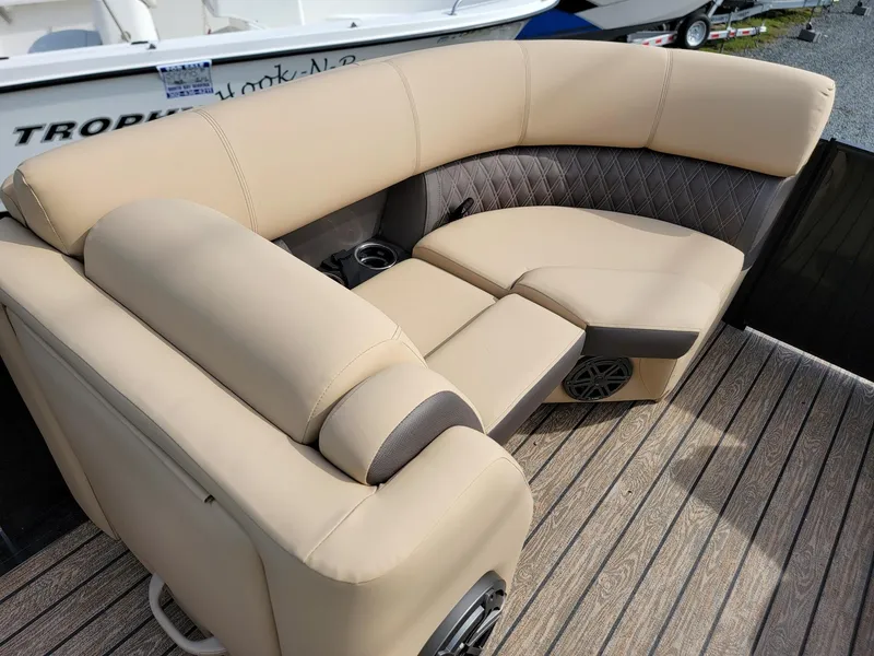 Slide: The Image of 2024 Harris Sunliner 210 boat with luxurious beige seating. - 33