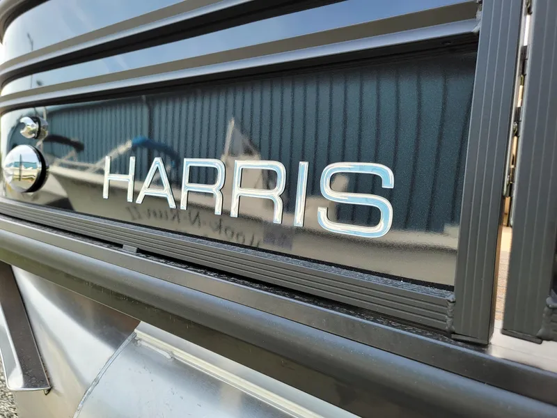 Slide: The Image of Close-up of 2024 Harris Sunliner 210 boat logo. - 34