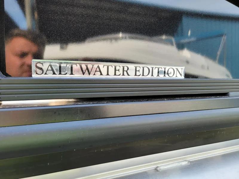 Slide: The Image of 2024 Harris Sunliner 210 Salt Water Edition badge on boat. - 35