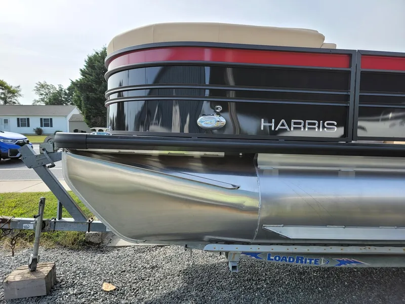 Slide: The Image of 2024 Harris Sunliner 210 pontoon boat on a LoadRite trailer. - 7