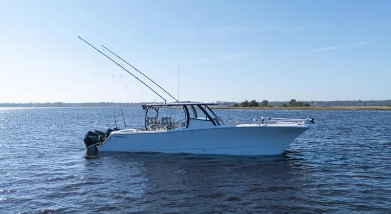 Slide: The Image of 2026 Front Runner 37 Catamaran on calm water, equipped with fishing rods. - 18