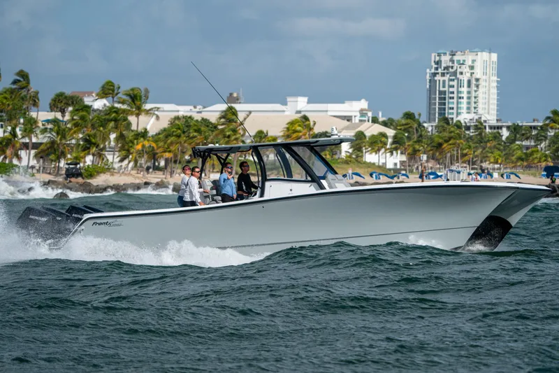 Slide: The Image of 2026 Front Runner 37 Catamaran cruising on ocean near tropical coastline. - 25