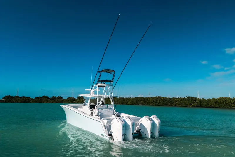 Slide: The Image of 2026 Front Runner 37 Catamaran cruising on turquoise water under clear blue sky. - 29