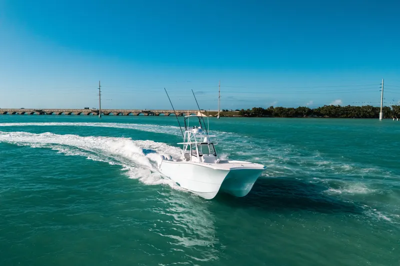 Slide: The Image of 2026 Front Runner 37 Catamaran cruising on turquoise waters under clear blue skies. - 31