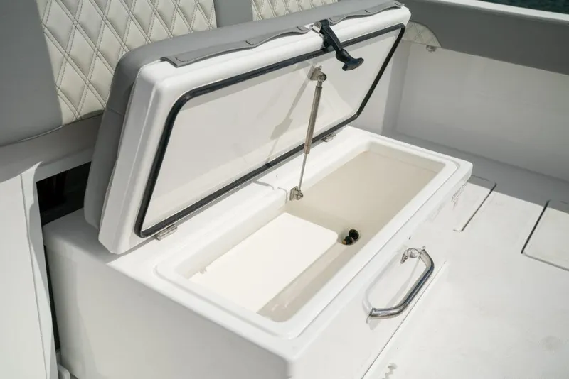Slide: The Image of Open storage compartment on 2026 Front Runner 37 Catamaran boat deck. - 9