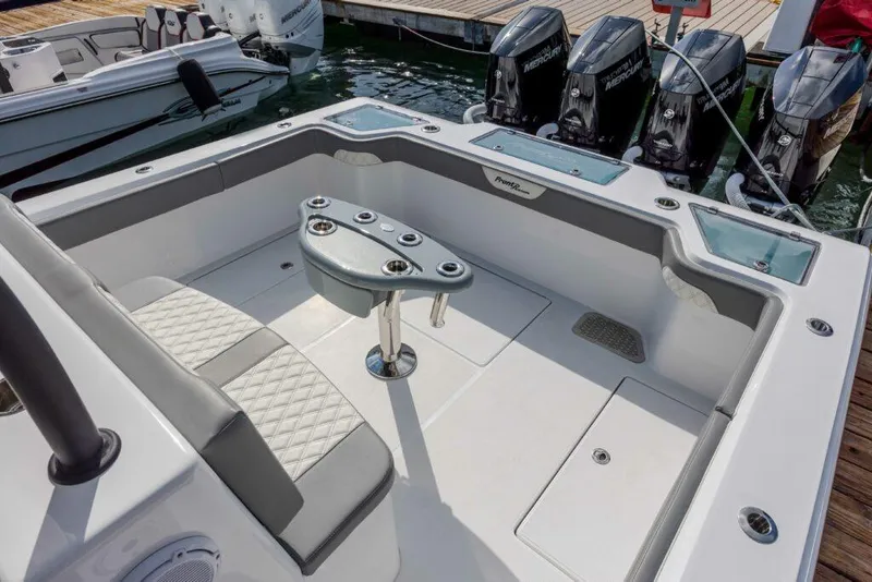 Slide: The Image of 2024 Front Runner 39 CC Custom boat with spacious seating and powerful outboard engines. - 10