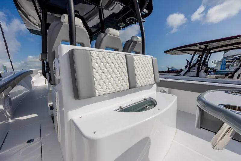 Slide: The Image of 2024 Front Runner 39 CC Custom boat interior with cushioned seating and modern design. - 13