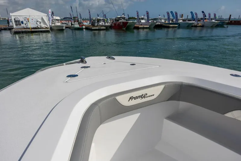Slide: The Image of 2024 Front Runner 39 CC Custom boat at marina with other boats in background. - 18
