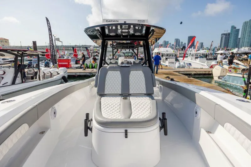 Slide: The Image of 2024 Front Runner 39 CC Custom boat at a marina with city skyline. - 19