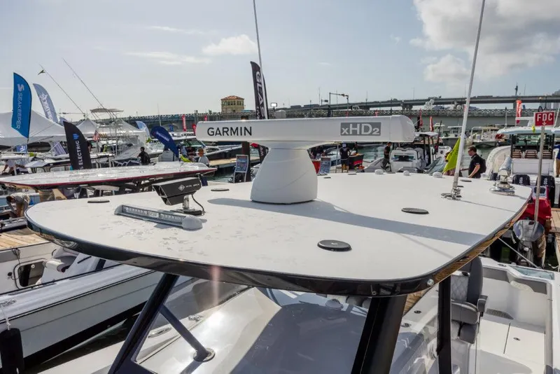 Slide: The Image of 2024 Front Runner 39 CC Custom boat with Garmin xHD2 radar at a marina. - 21