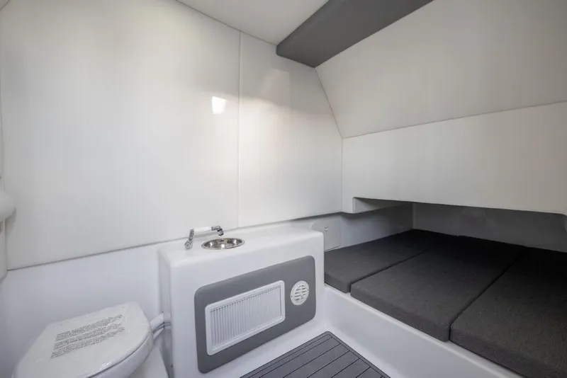 Slide: The Image of 2024 Front Runner 39 CC Custom boat interior with sink, toilet, and sleeping area. - 23