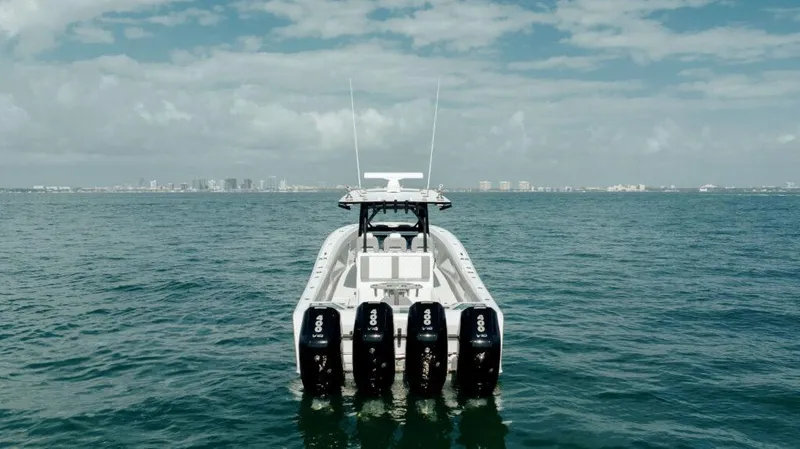 Slide: The Image of 2024 Front Runner 39 CC Custom boat with four outboard engines on open water. - 27