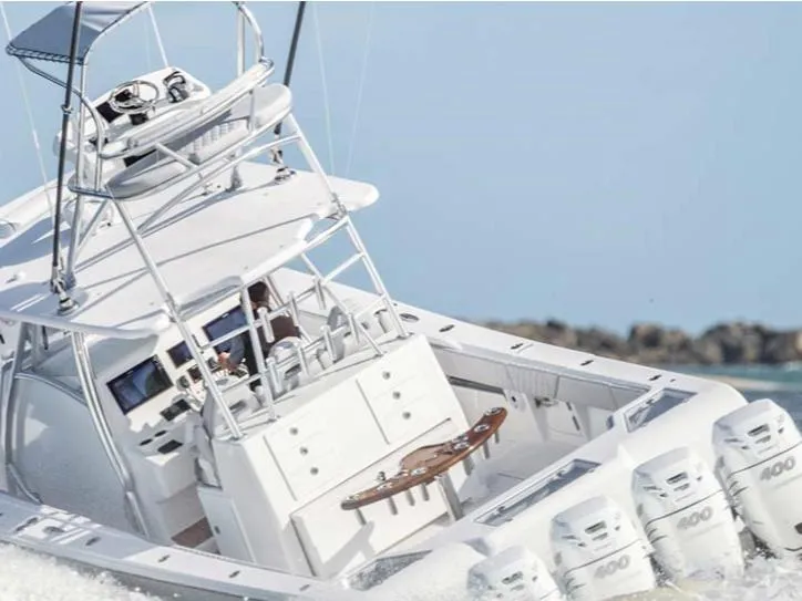 Slide: The Image of 2026 Front Runner 39 CC Custom boat with multiple engines cruising on water. - 29