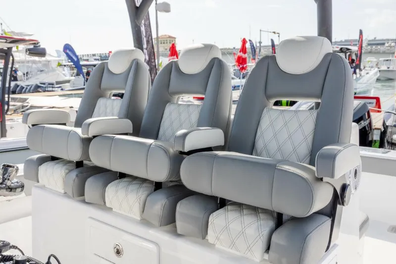 Slide: The Image of 2024 Front Runner 39 CC Custom boat seats at marina. - 9