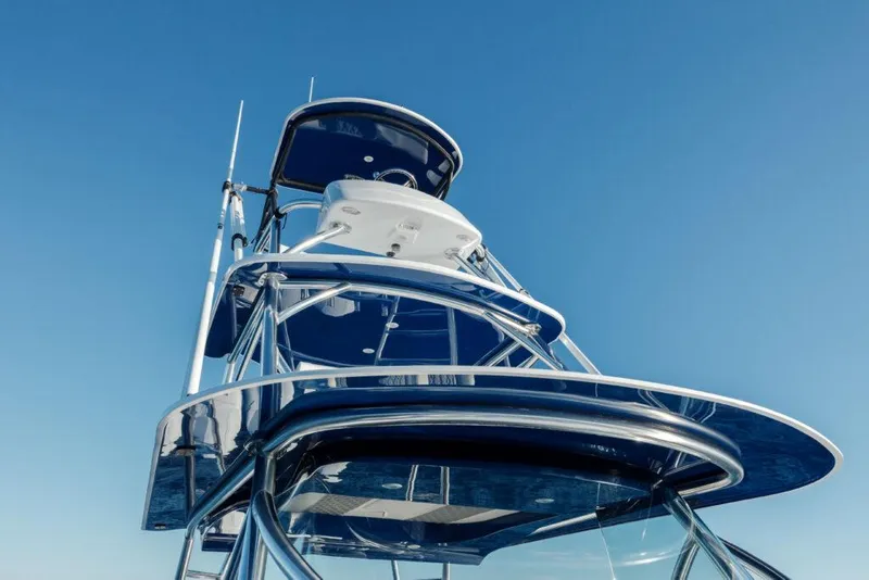 Slide: The Image of 2024 Front Runner 47 CC Custom boat tower against clear blue sky. - 1