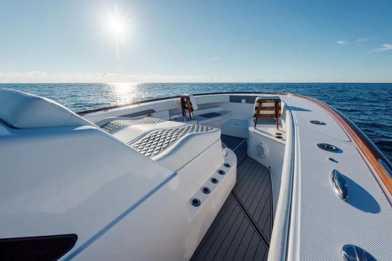 Slide: The Image of 2024 Front Runner 47 CC Custom boat deck with ocean view and sunlit sky. - 11