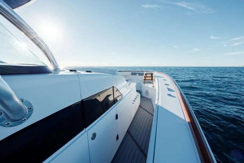Slide: The Image of 2024 Front Runner 47 CC Custom yacht on open water, sunny day. - 21