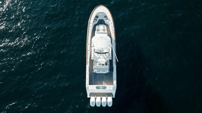 Slide: The Image of Aerial view of 2024 Front Runner 47 CC Custom boat on open water. - 26